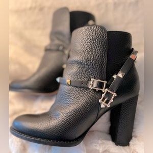 Valentino booties in black leather and gold stud accent belt.